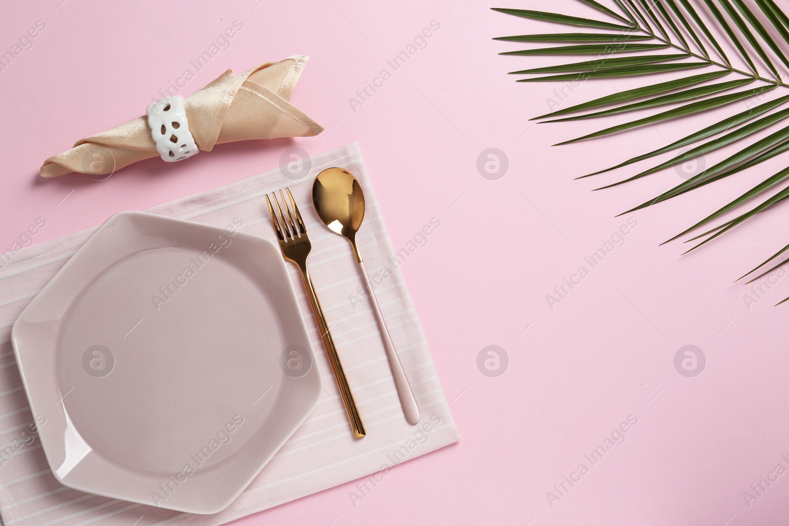 Photo of Stylish elegant table setting on color background, top view. Space for text