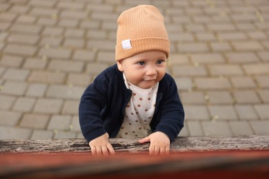 Portrait of cute little baby in park