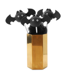 Photo of Delicious bat cake pops on white background. Halloween season