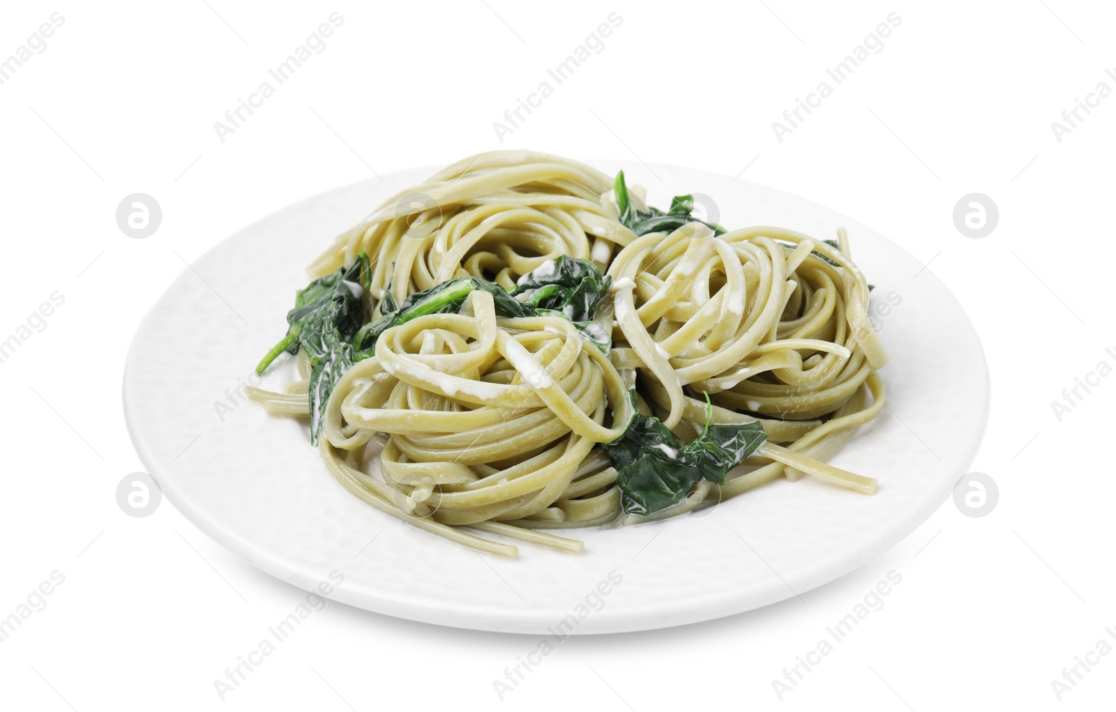 Photo of Tasty pasta with spinach and sauce isolated on white