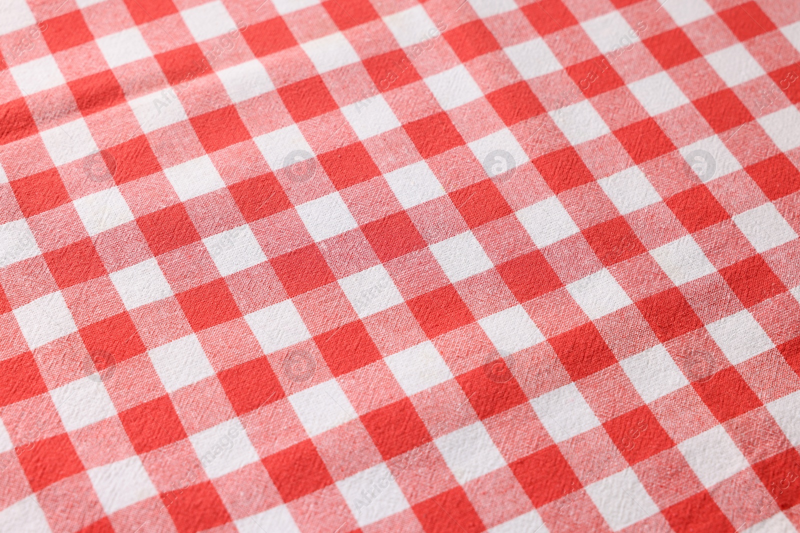 Photo of Red checkered tablecloth as background, closeup view