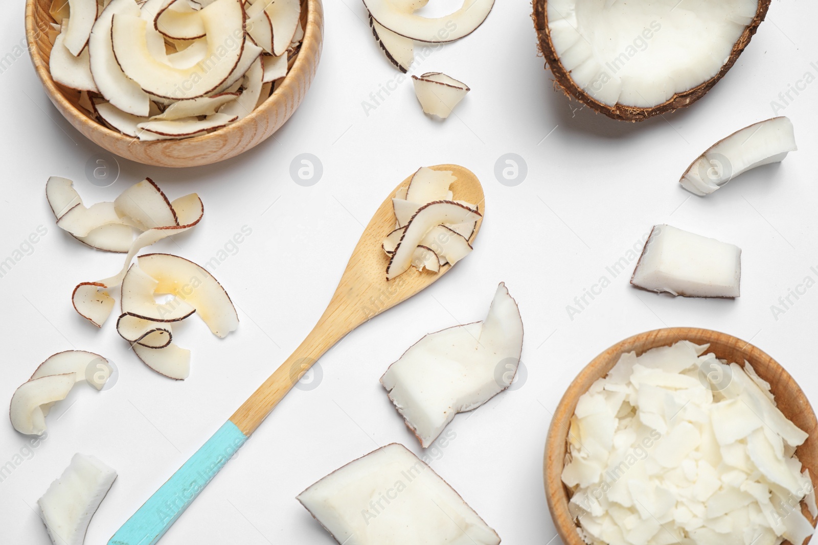 Photo of Composition with tasty coconut chips on white background, top view