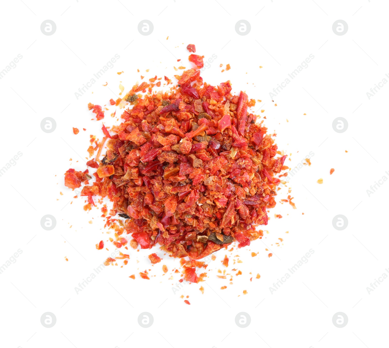 Photo of Aromatic spice. Pile of red chili pepper flakes isolated on white, top view