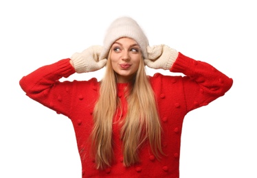 Portrait of emotional young woman in stylish clothes on white background. Winter atmosphere