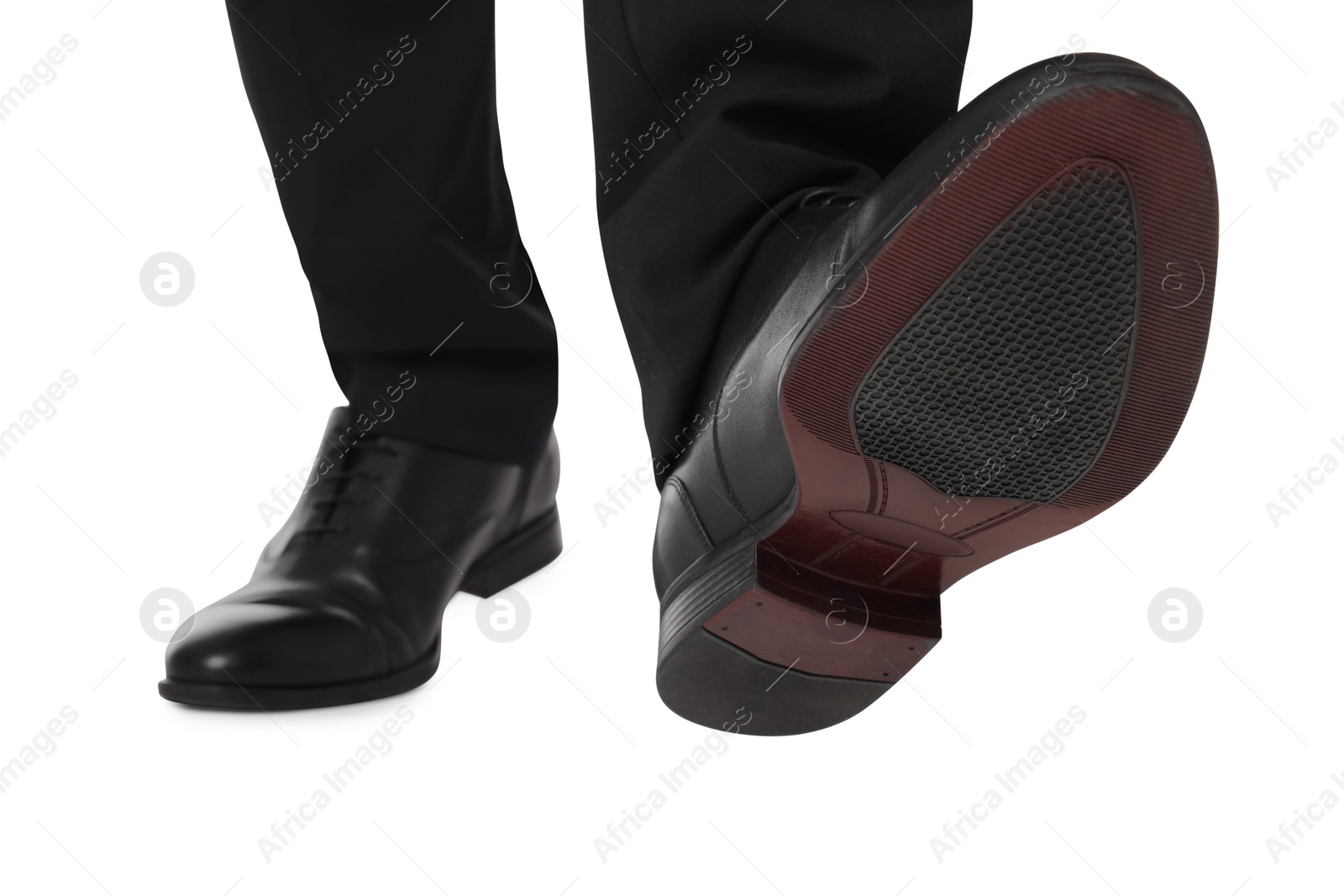 Photo of Businessman in leather shoes on white background, closeup