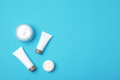 Photo of Flat lay composition with cosmetic products on color background