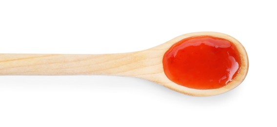 Photo of Spicy chili sauce in spoon isolated on white, top view