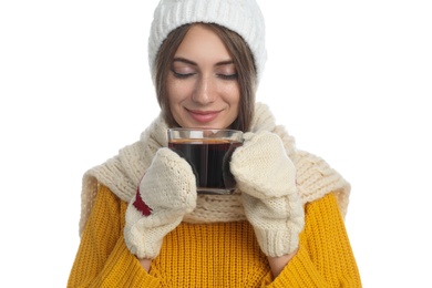 Photo of Happy beautiful woman with cup of mulled wine on white background