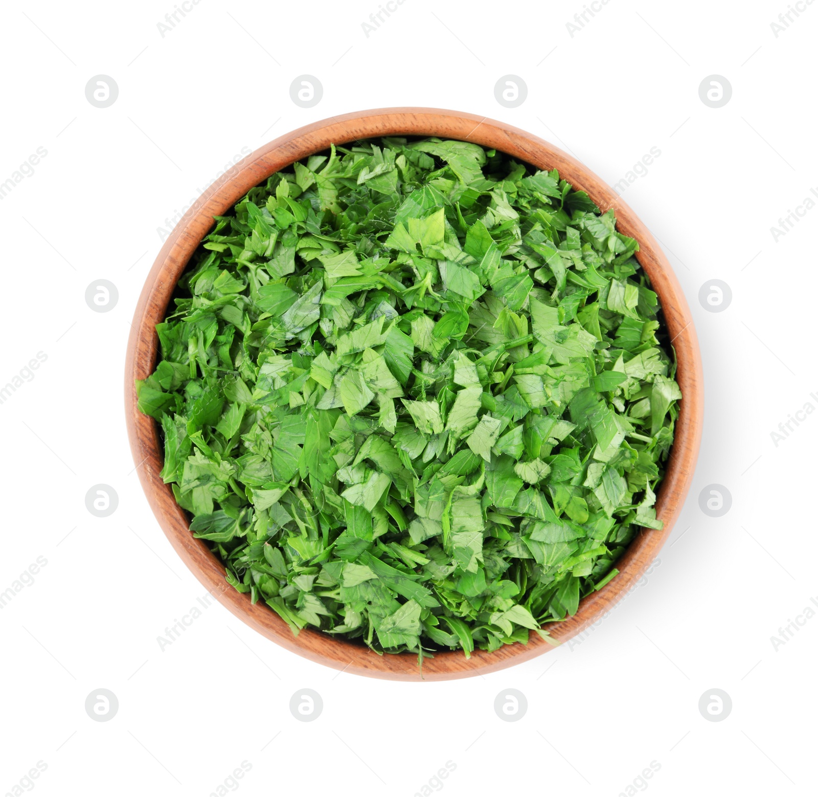 Chopped parsley leaves in wooden bowl isolated on white, top view Photo of Chopped parsley leaves in wooden bowl isolated on white, top view