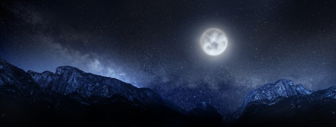 Image of Picturesque view of starry sky over beautiful mountains on full moon night. Banner design