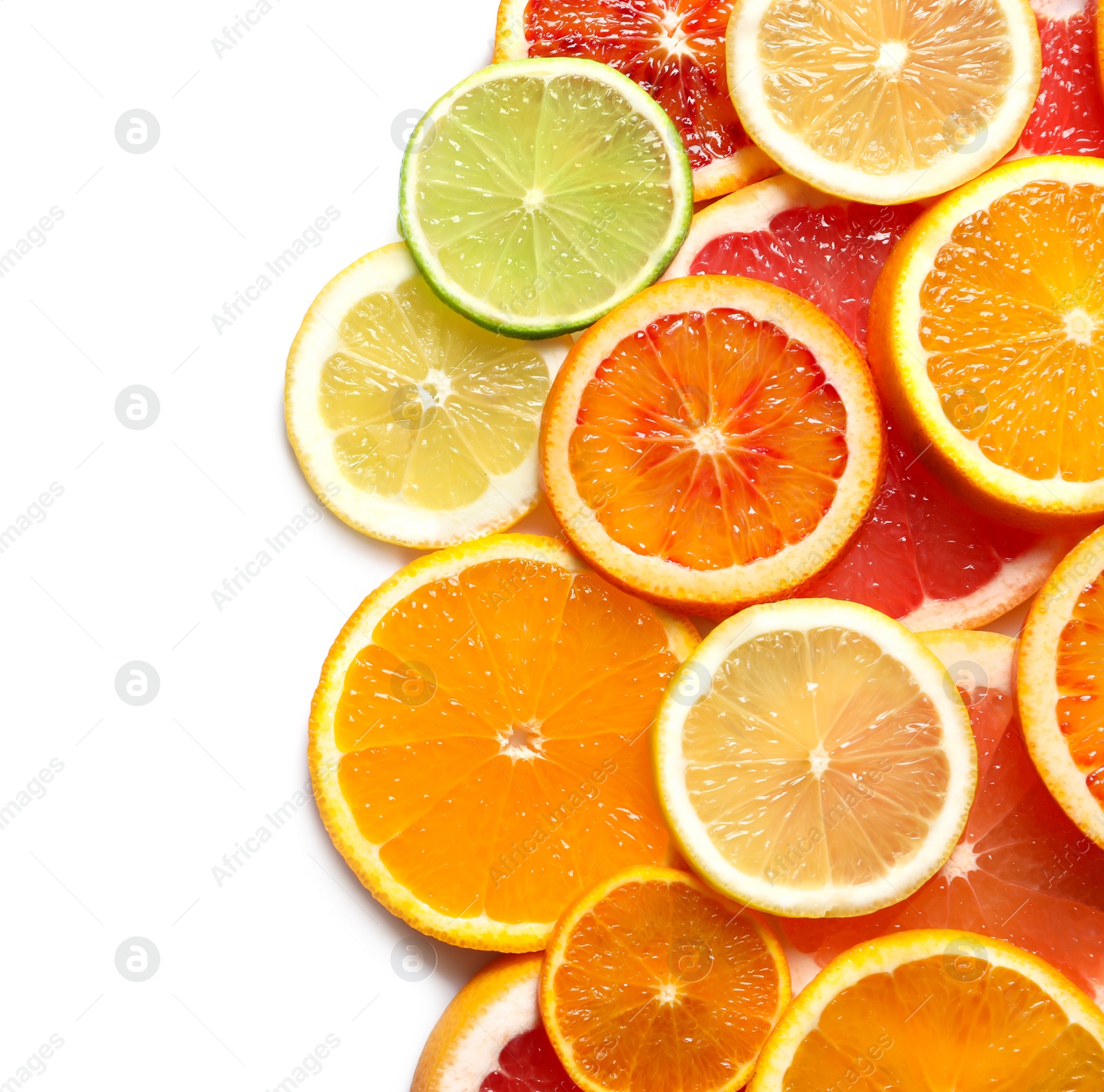 Photo of Slices of fresh citrus fruits on white background, top view