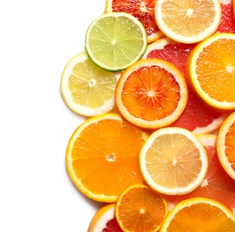 Photo of Slices of fresh citrus fruits on white background, top view