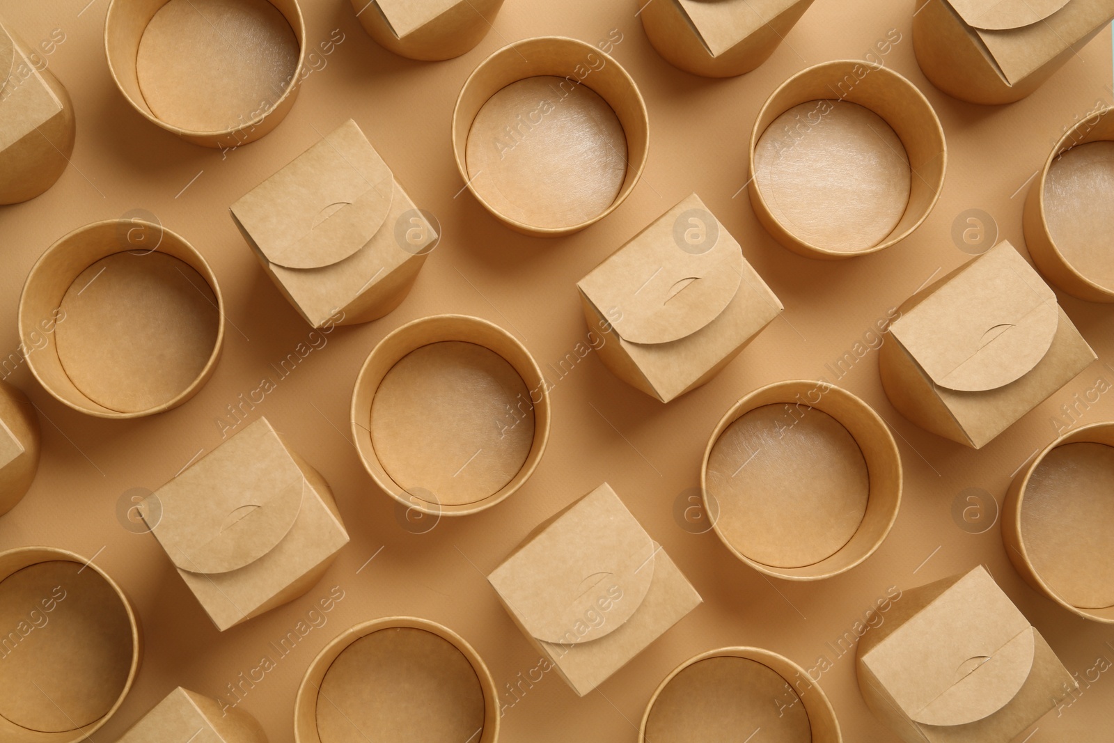 Photo of Eco friendly food containers on beige background, flat lay