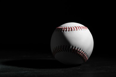 Photo of Baseball ball on black background, space for text. Sports game