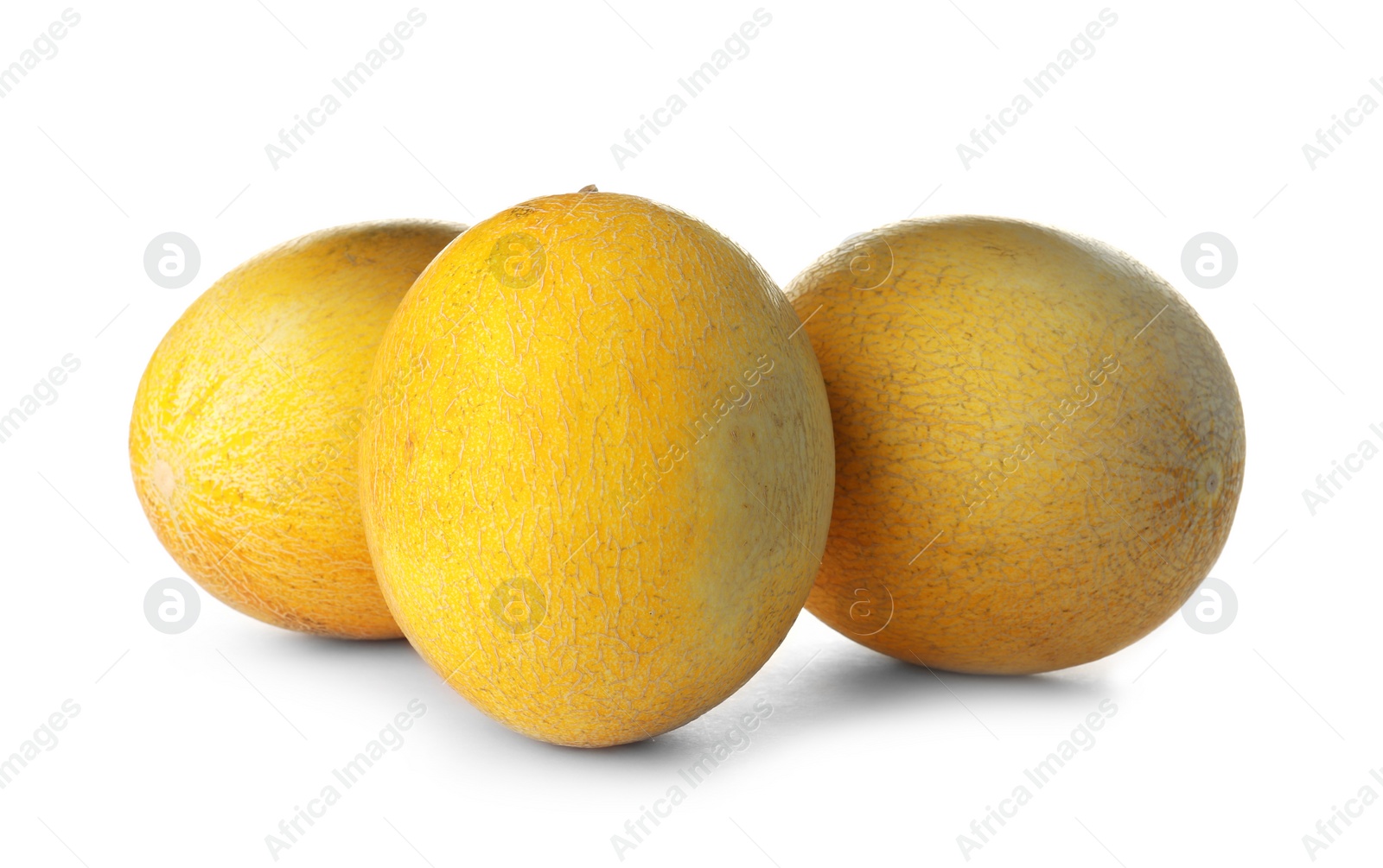 Photo of Whole tasty ripe melons on white background