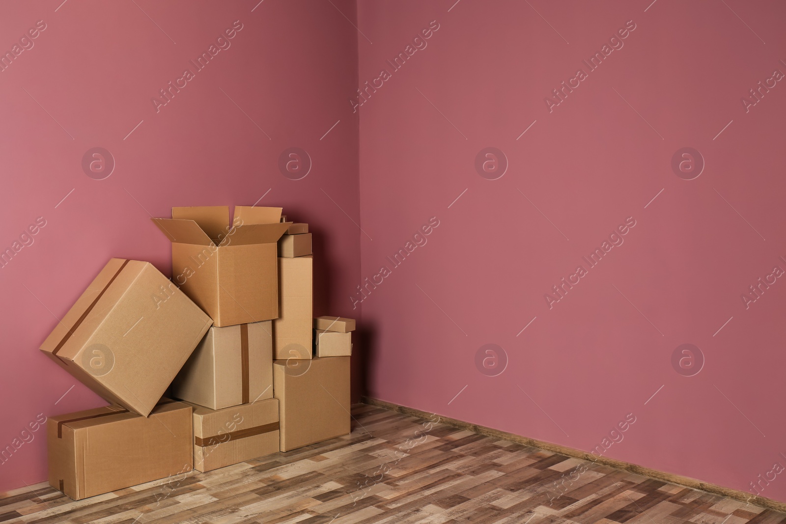 Photo of Cardboard boxes on floor indoors