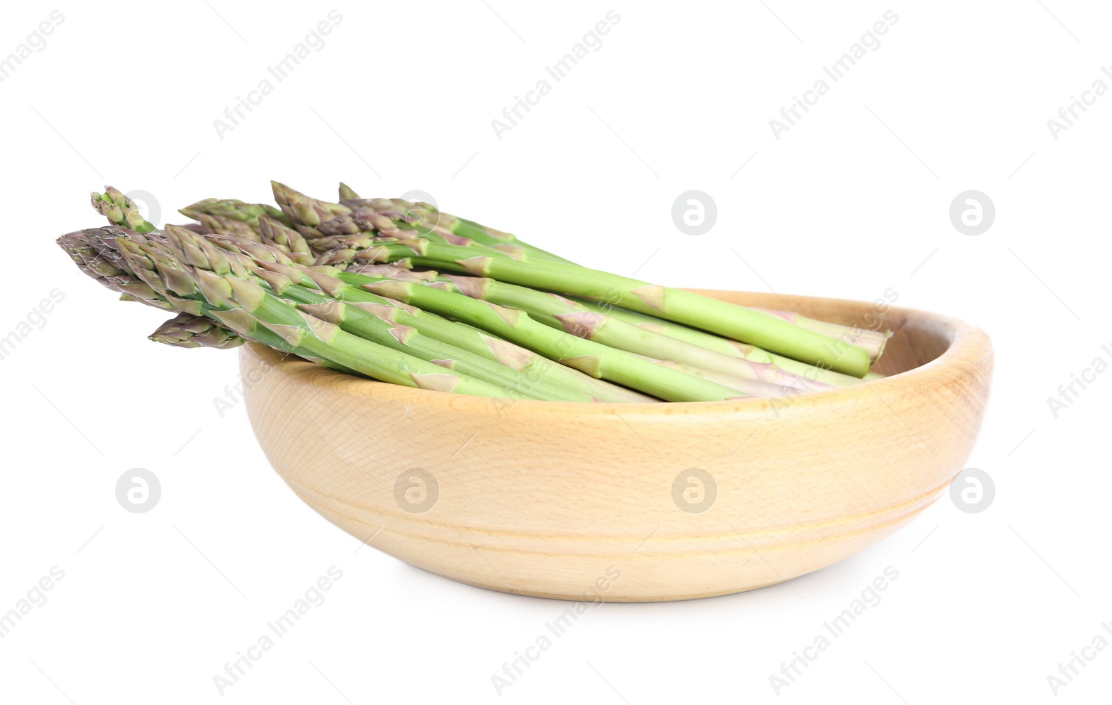 Photo of Fresh raw asparagus in wooden bowl isolated on white