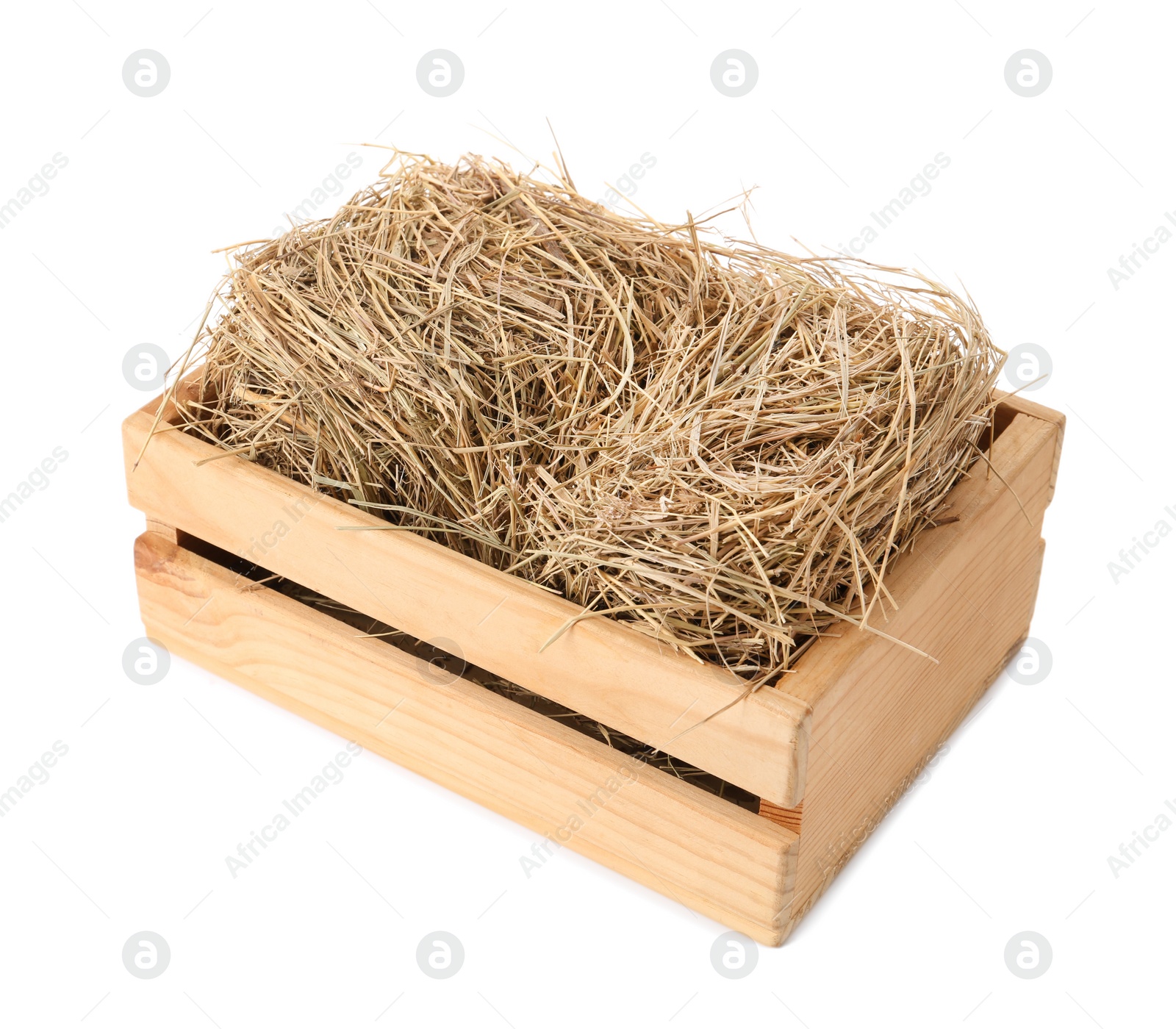 Photo of Dried hay in wooden crate on white background