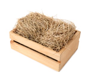 Dried hay in wooden crate on white background