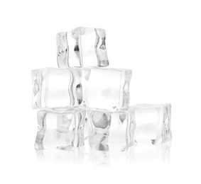 Many crystal clear ice cubes isolated on white