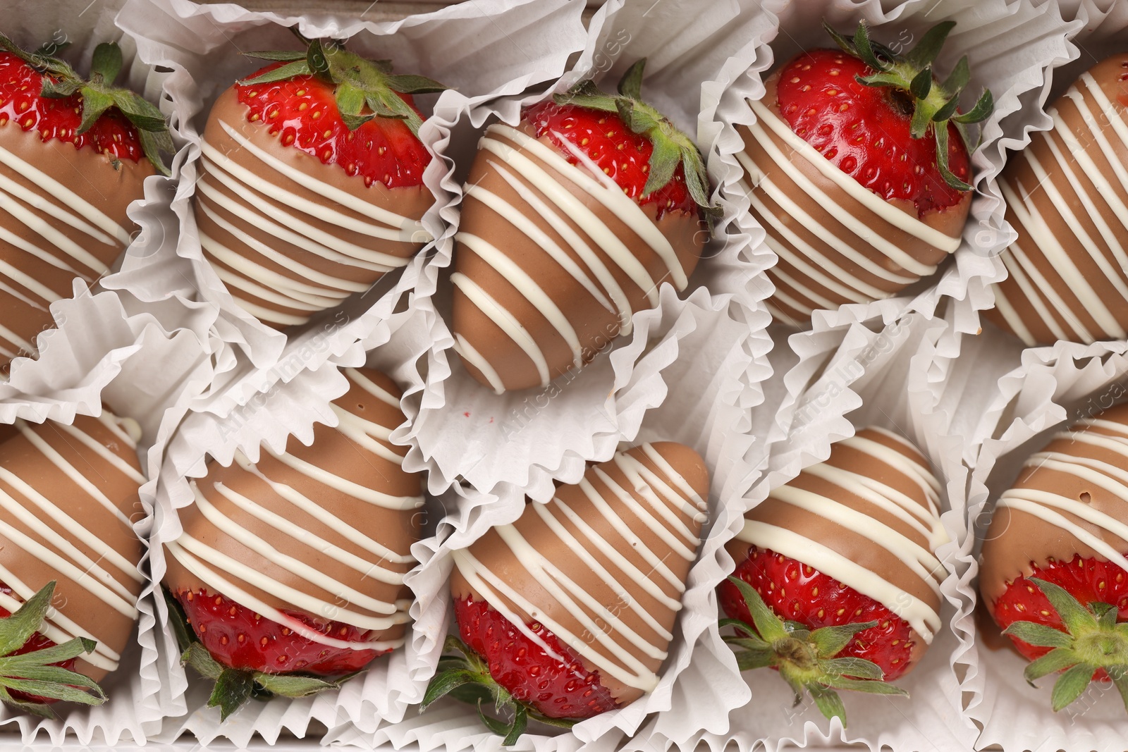 Photo of Delicious chocolate covered strawberries in box, top view