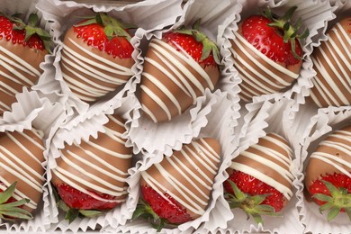 Delicious chocolate covered strawberries in box, top view