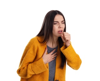 Beautiful young woman coughing against white background