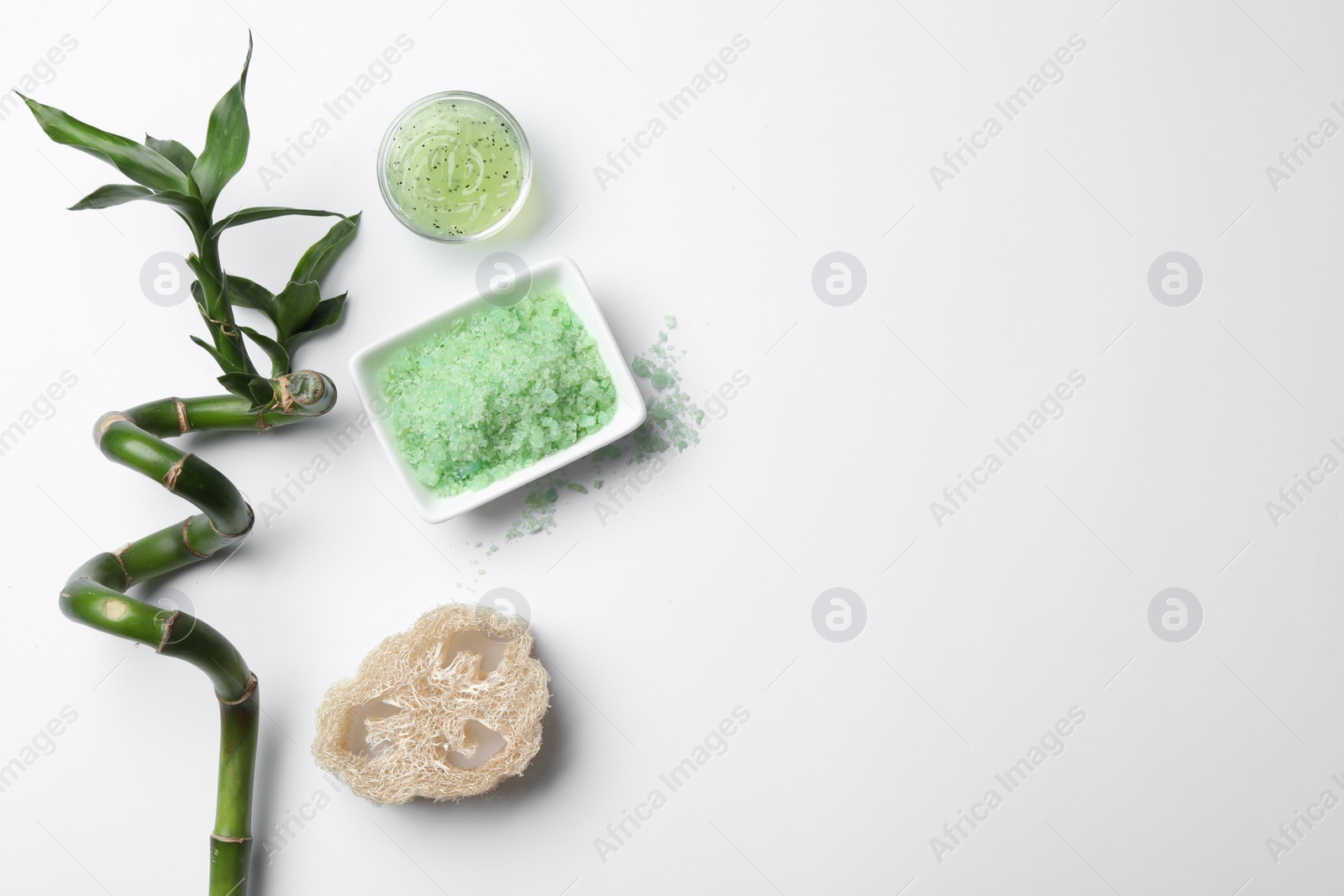 Photo of Flat lay spa composition with aromatic salt, scrub and space for text on white background