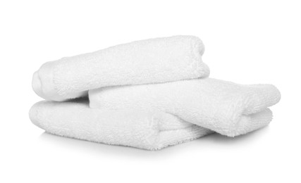 Folded soft terry towels on white background