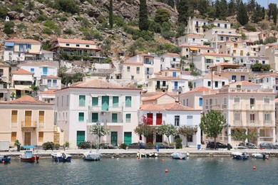 Photo of Beautiful view of coastal city with boats on sunny day