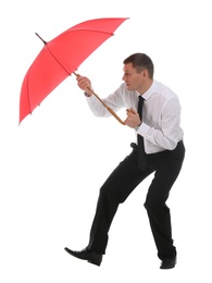 Businessman with red umbrella on white background