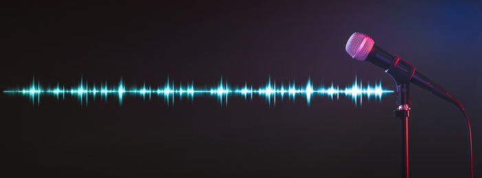 Microphone and radio wave on dark background. Banner design