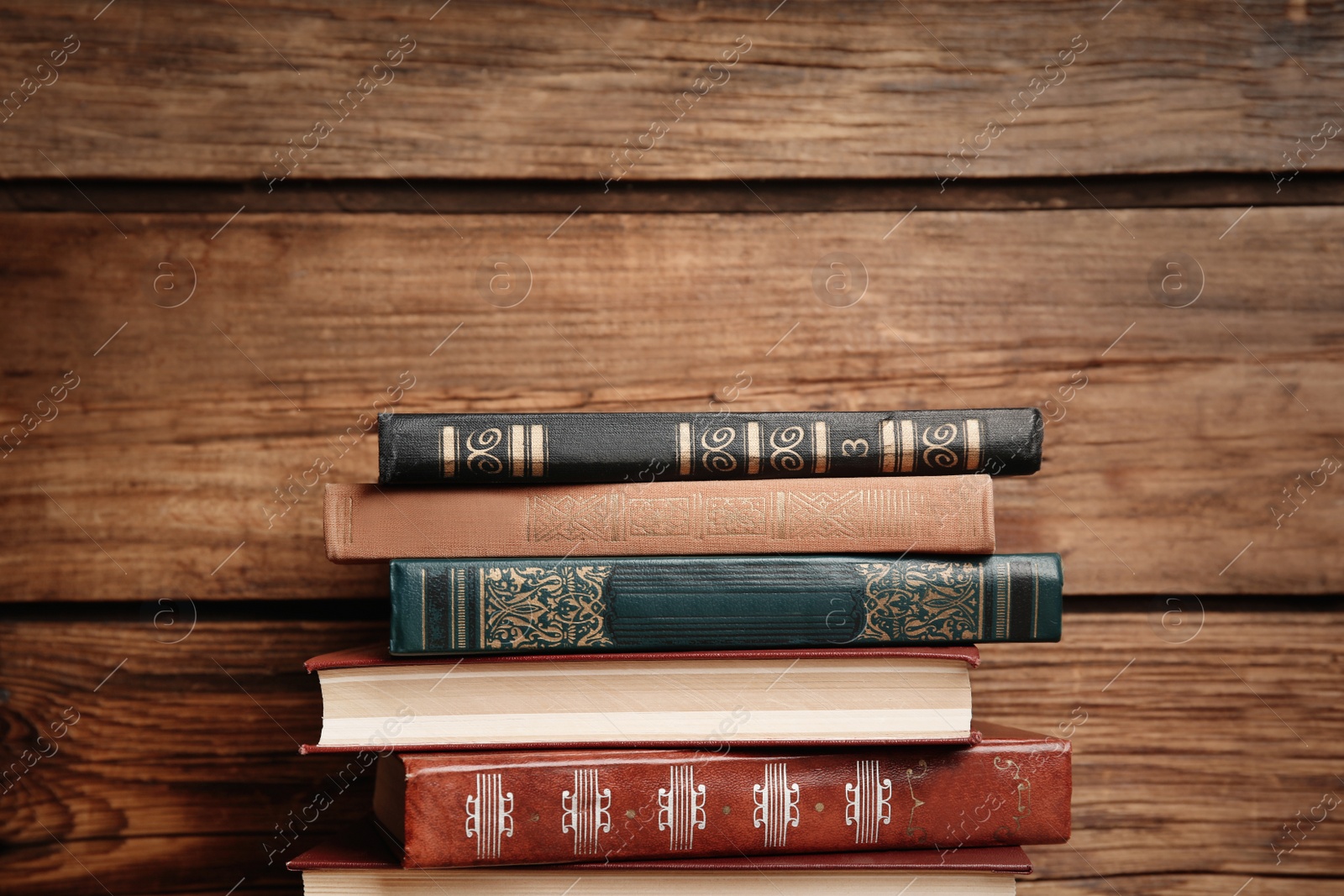 Photo of Collection of different books on wooden background