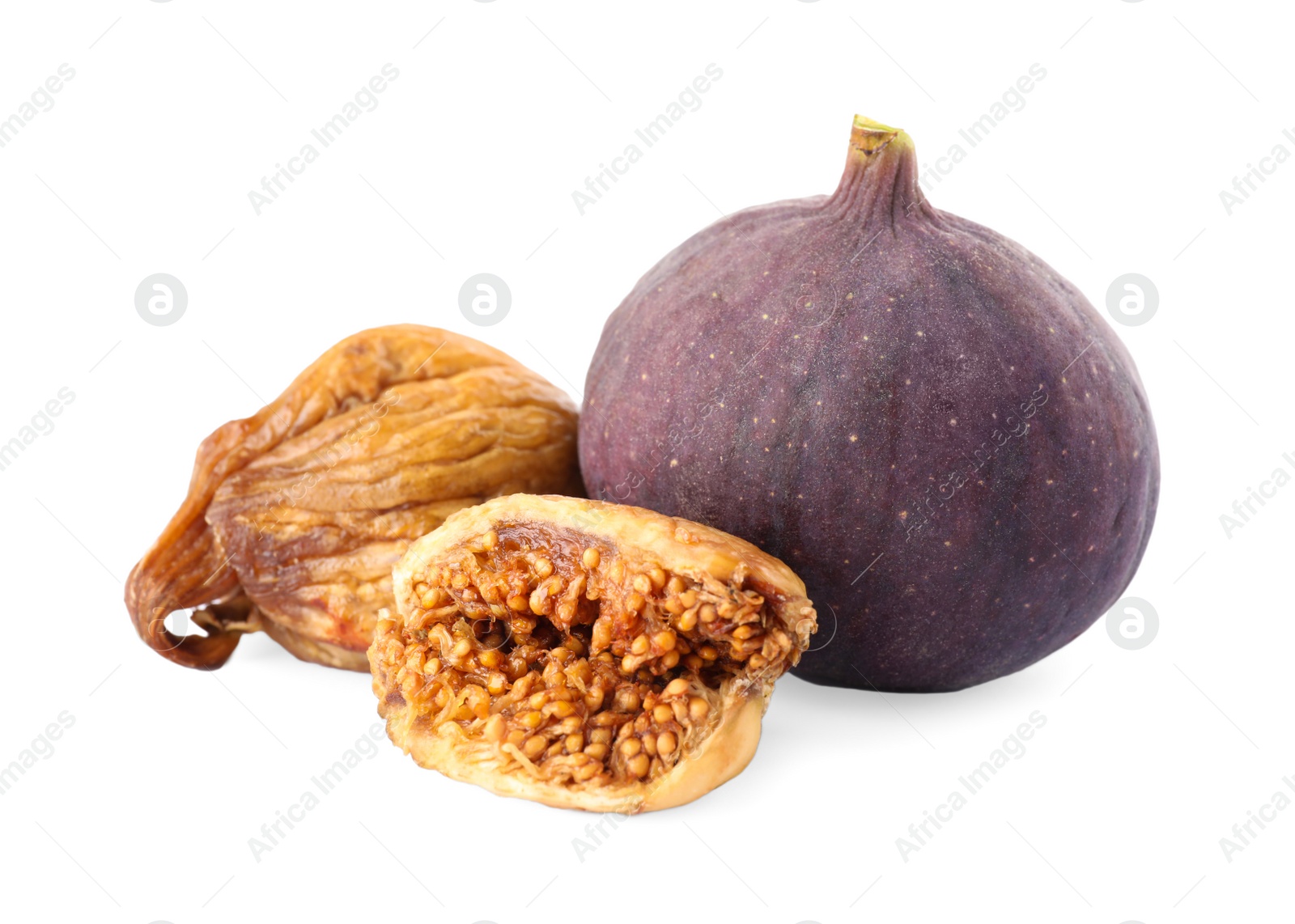 Photo of Tasty dried and raw figs on white background