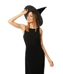 Photo of Beautiful young woman wearing witch costume for Halloween party on white background