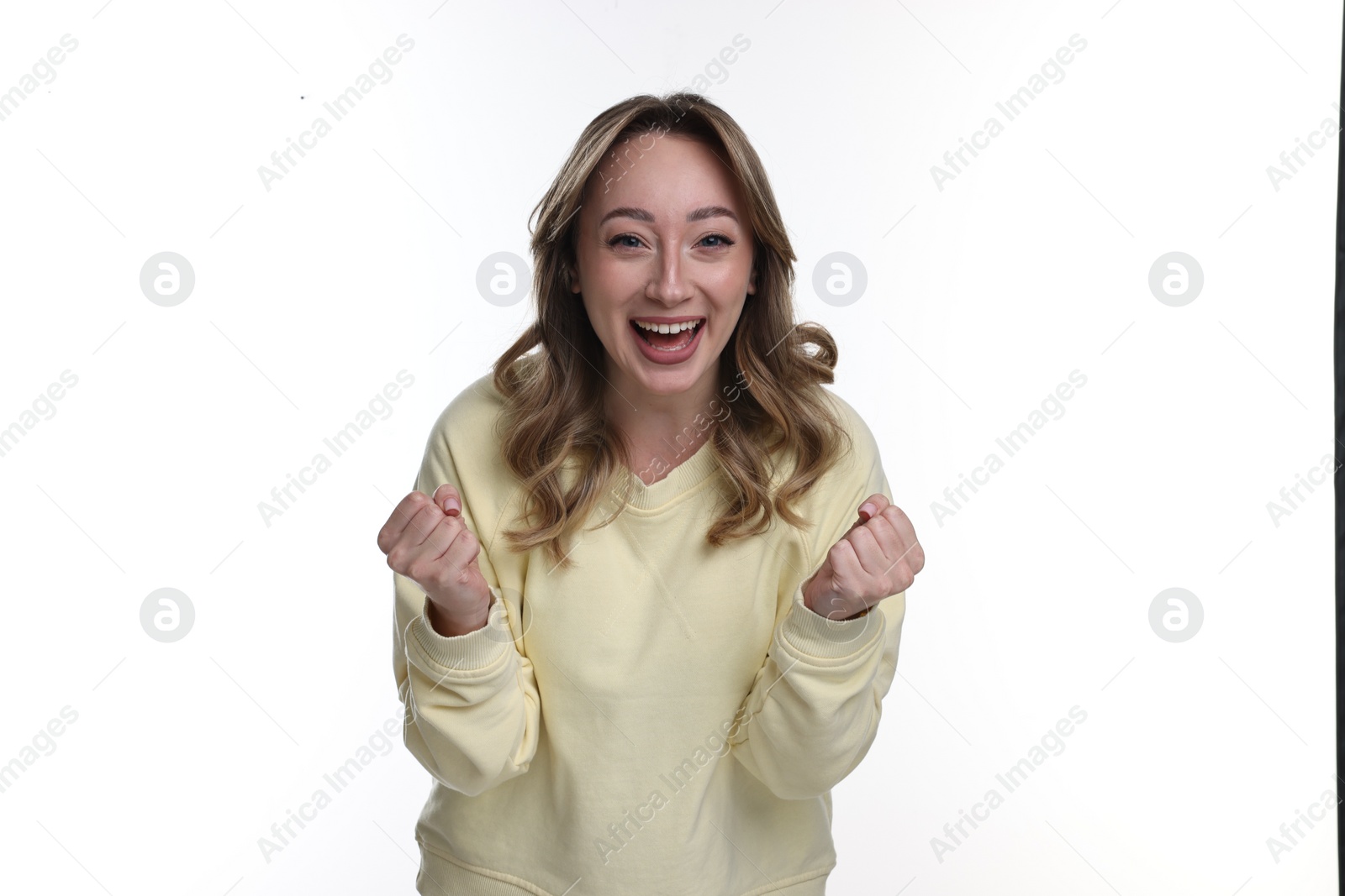 Photo of Portrait of happy surprised woman on white background