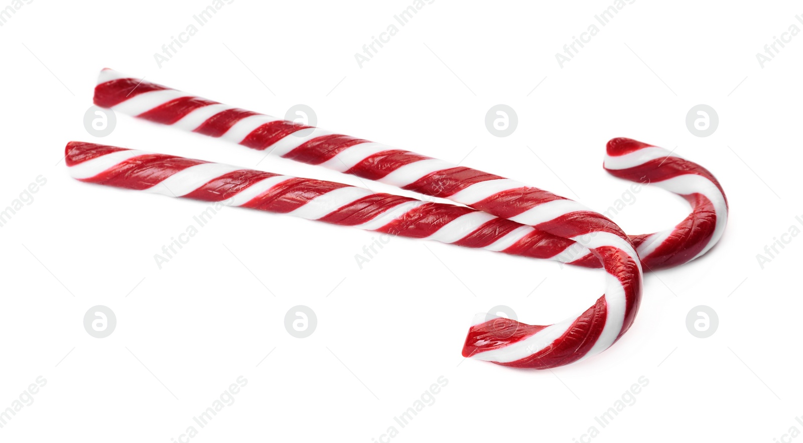 Photo of Delicious Christmas candy canes on white background