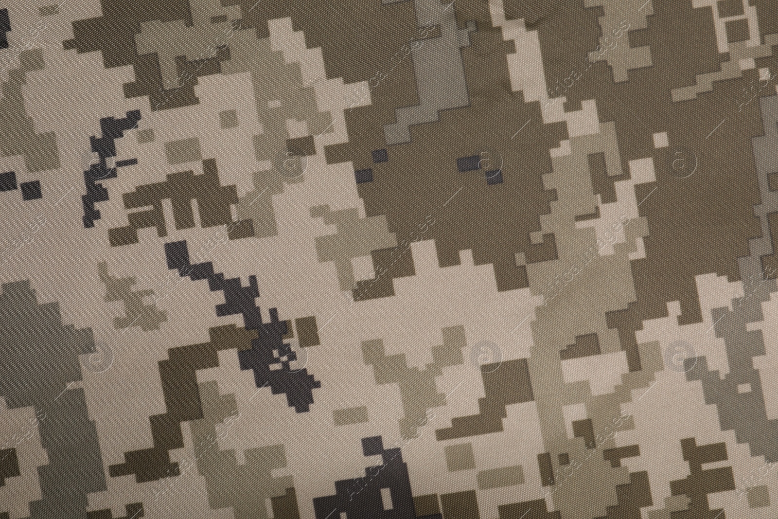 Photo of Texture of camouflage fabric as background, top view