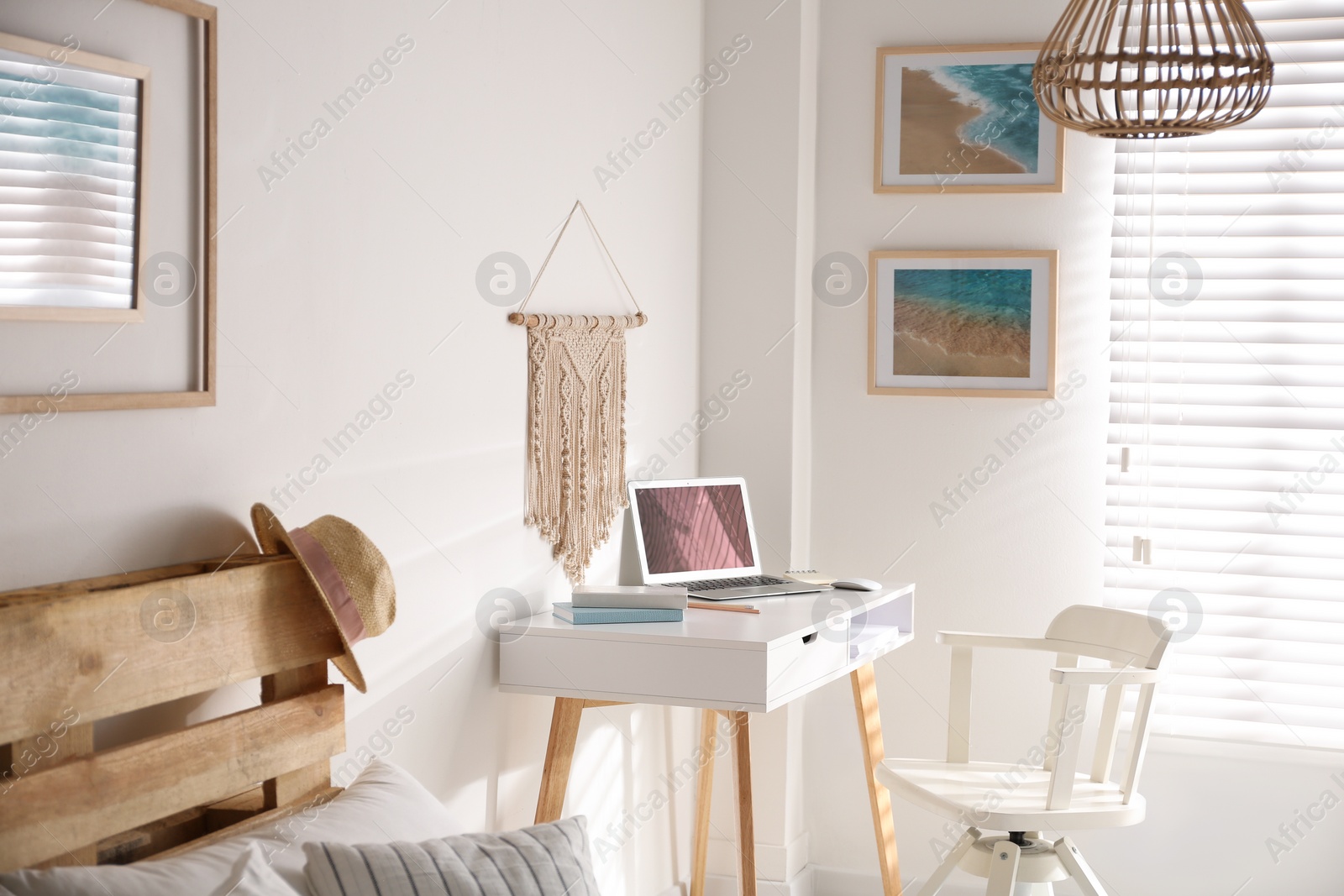 Photo of Stylish room interior with workplace near window