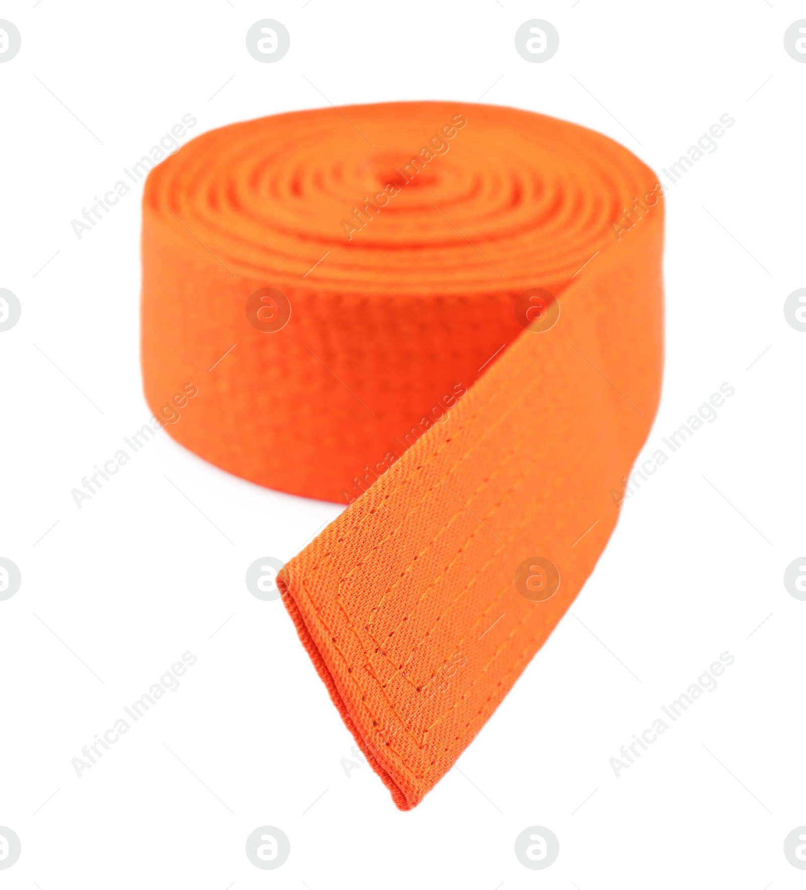 Photo of Orange karate belt isolated on white. Martial arts uniform