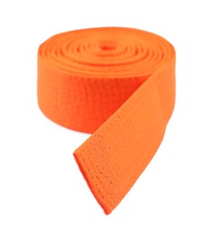 Photo of Orange karate belt isolated on white. Martial arts uniform