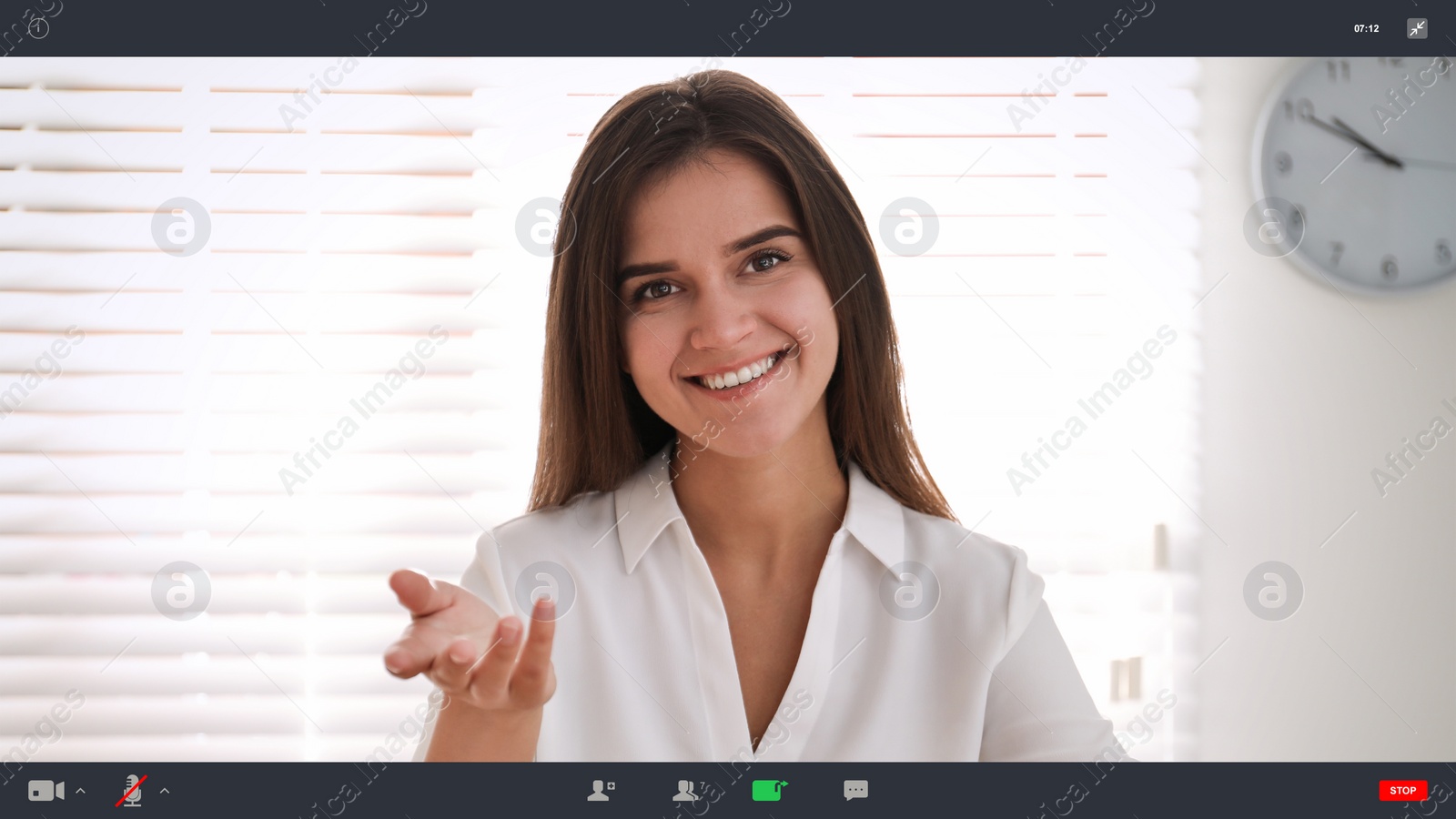 Image of Woman communicating with coworkers from home using video chat, view through camera
