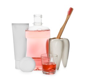 Mouthwash and other oral hygiene products on white background