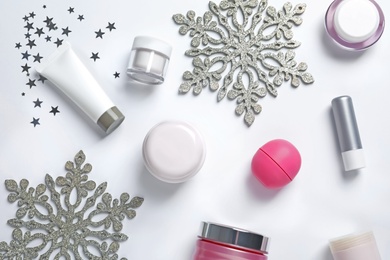 Photo of Set of cosmetic products on white background, flat lay. Winter care