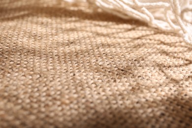 Texture of beige burlap fabric, closeup view