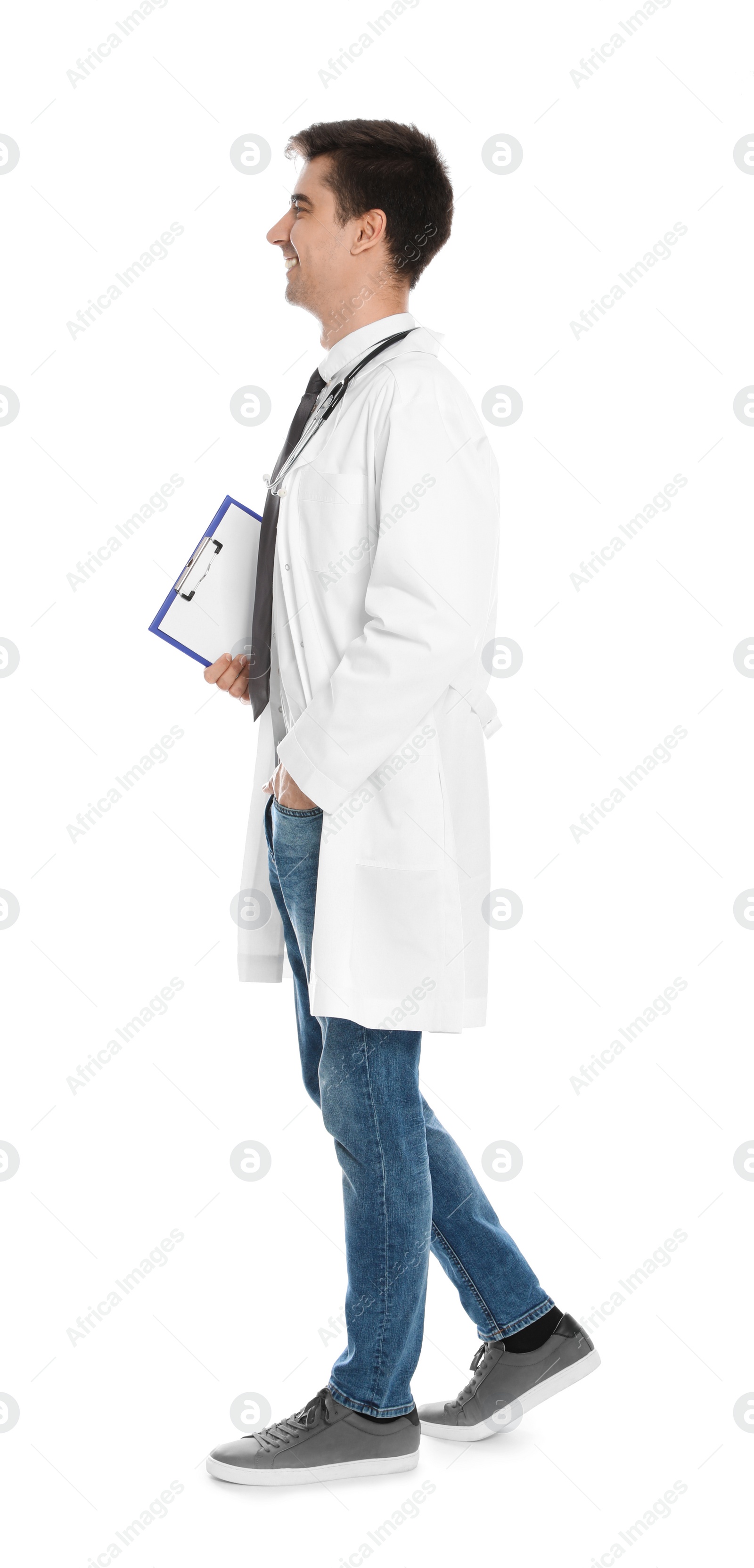 Photo of Full length portrait of medical doctor with clipboard and stethoscope isolated on white