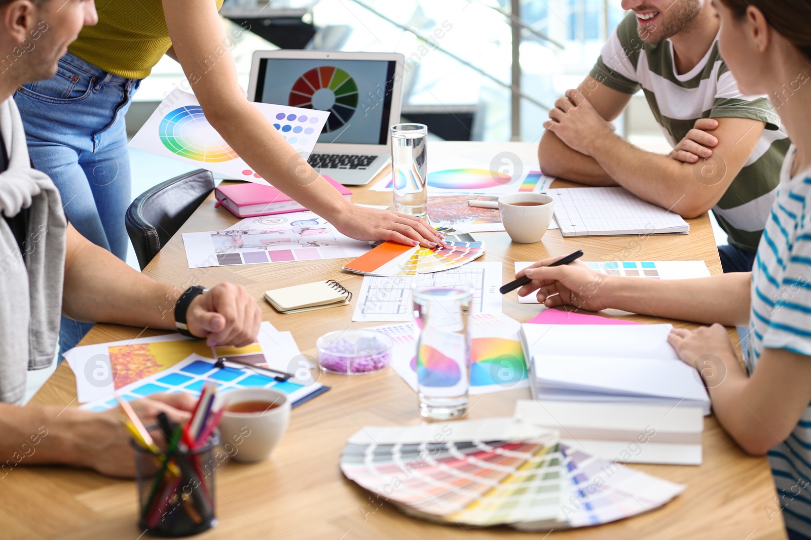 Photo of Professional team of interior designers  working in office, closeup