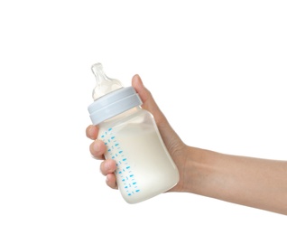 Photo of Woman holding baby bottle with milk on white background