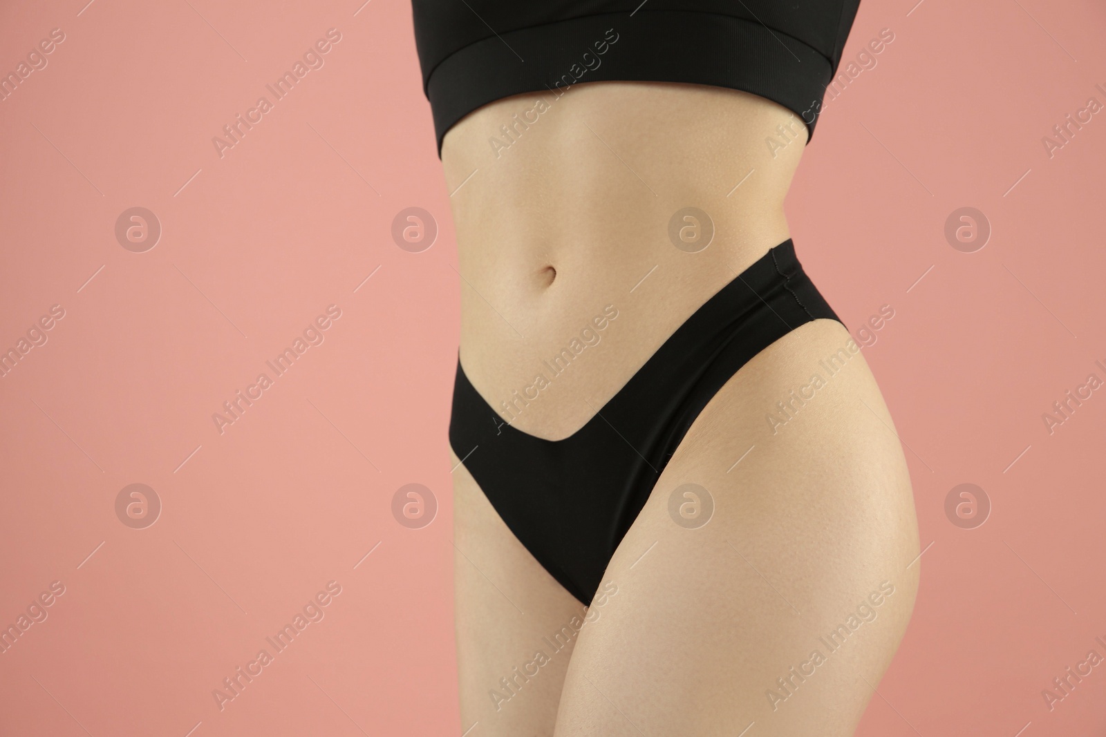 Photo of Gynecology. Woman in underwear on pink background, closeup. Space for text