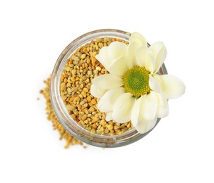 Photo of Fresh bee pollen granules in jar and flower isolated on white, top view